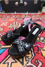 Load image into Gallery viewer, Deadstock vintage Steve Madden black platform wedge sandals with Y2K strappy design, shown on model's feet.