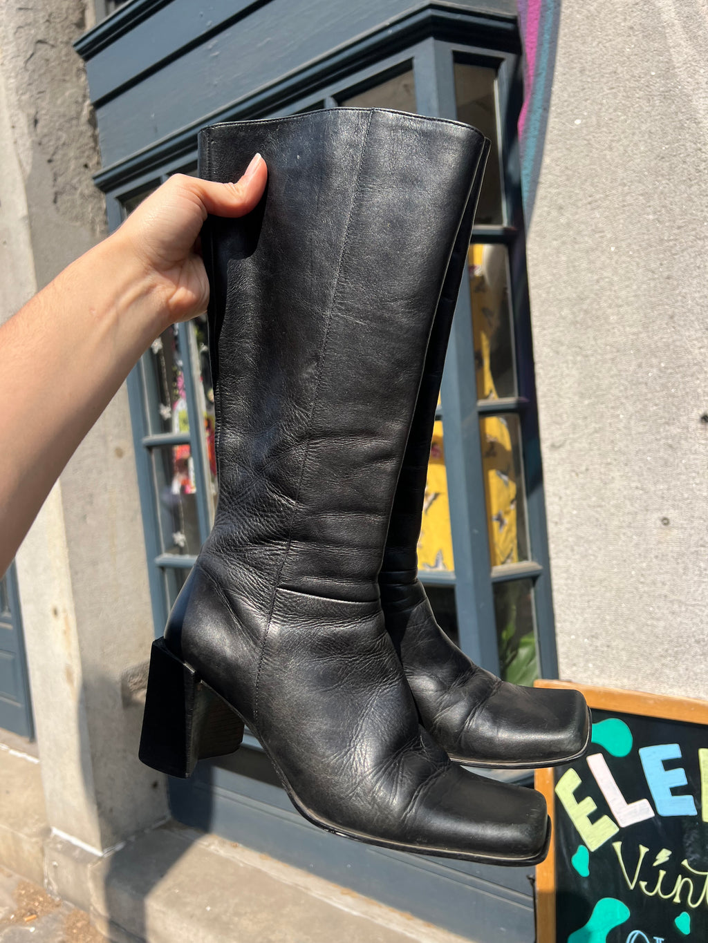 Vintage black leather mid-calf boots by Elektra Vintage, size 6, featuring classic design and sturdy heel.