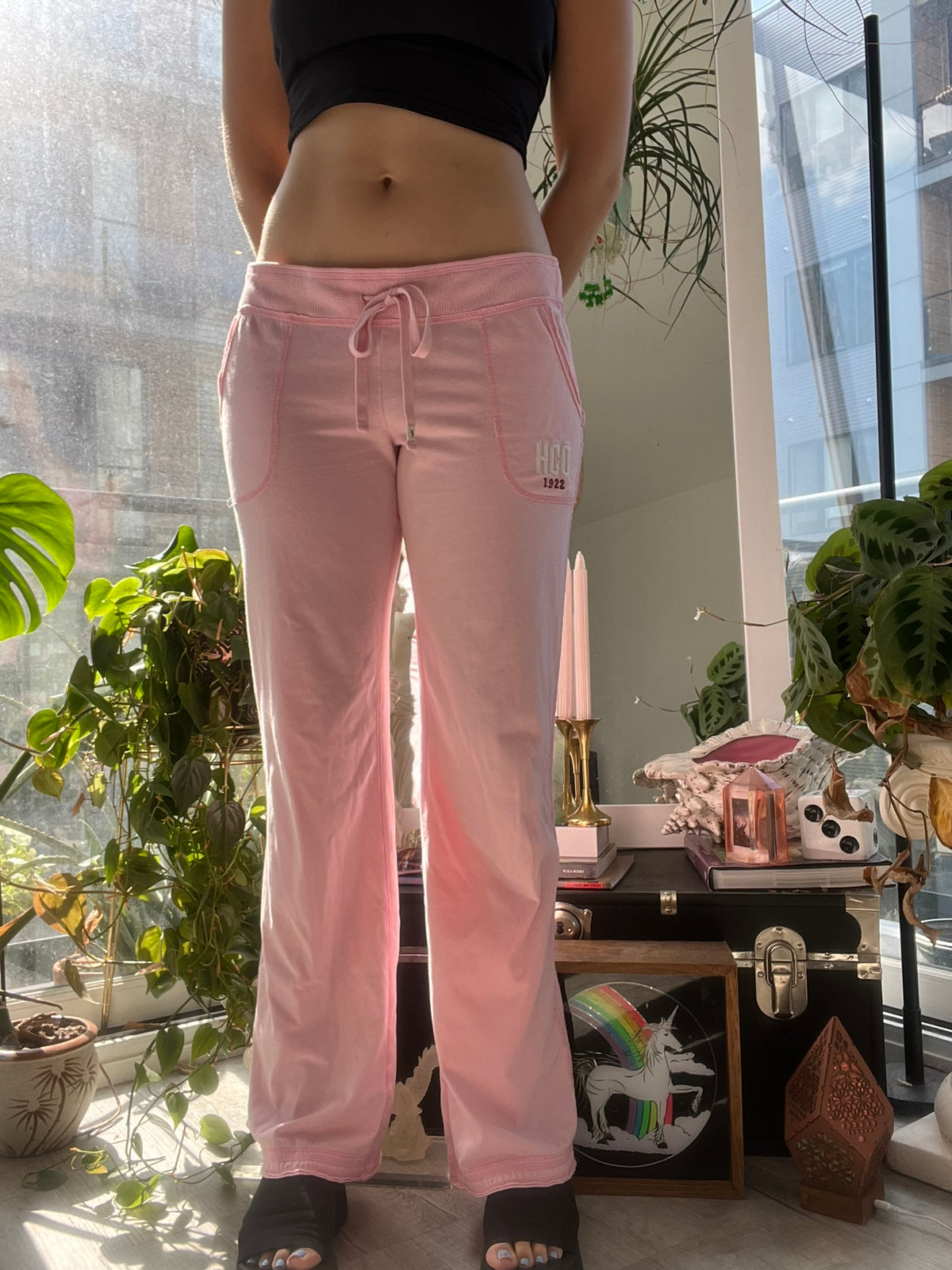 Pink Hollister Co women's sweatpants from the 2000s, soft casual bottoms by Elektra Vintage, with a relaxed fit and comfortable fabric.