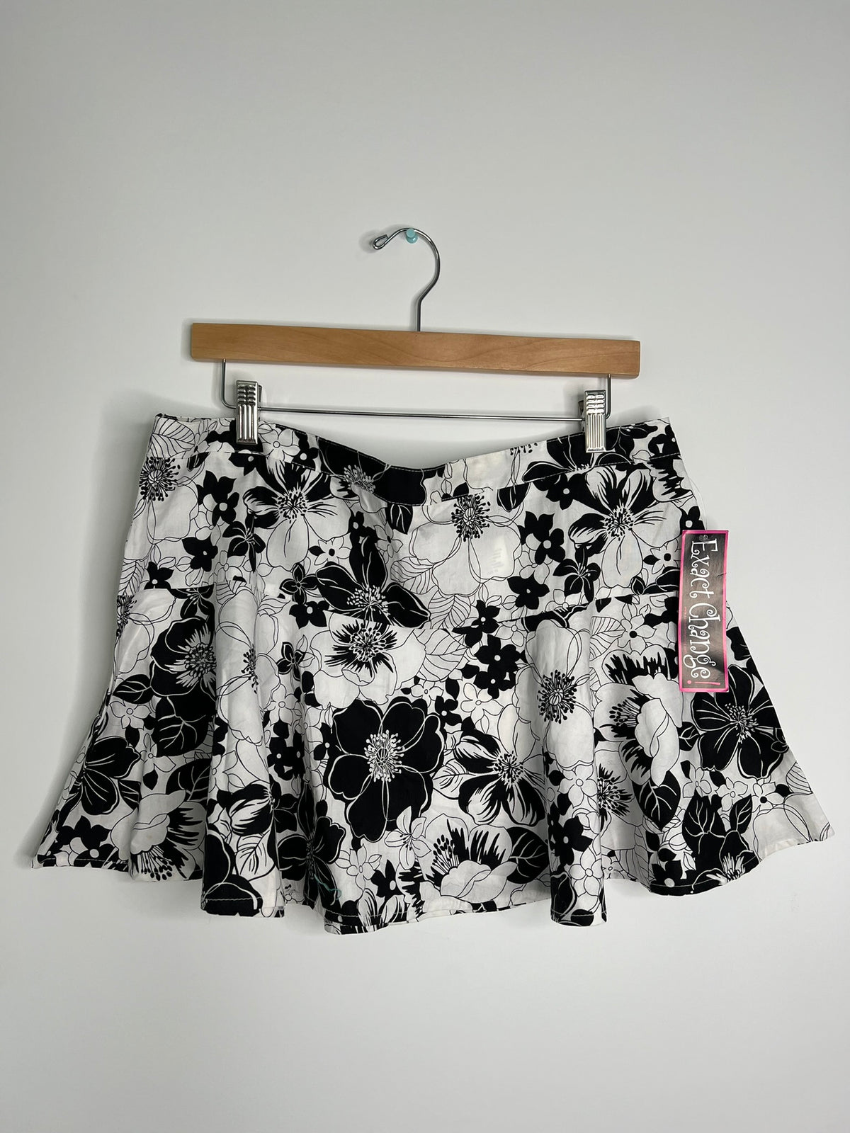 Vintage 2000s Elektra Vintage exact change skirt displayed on a hanger, showcasing its retro style and fabric details.