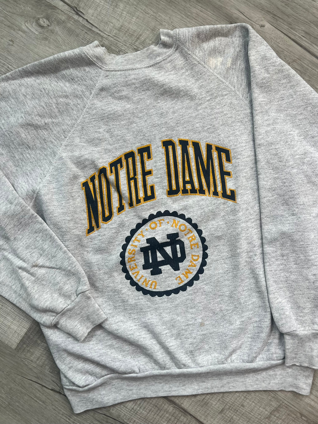 Vintage University of Notre Dame crewneck sweatshirt by Elektra Vintage, featuring a classic university logo on soft fabric.