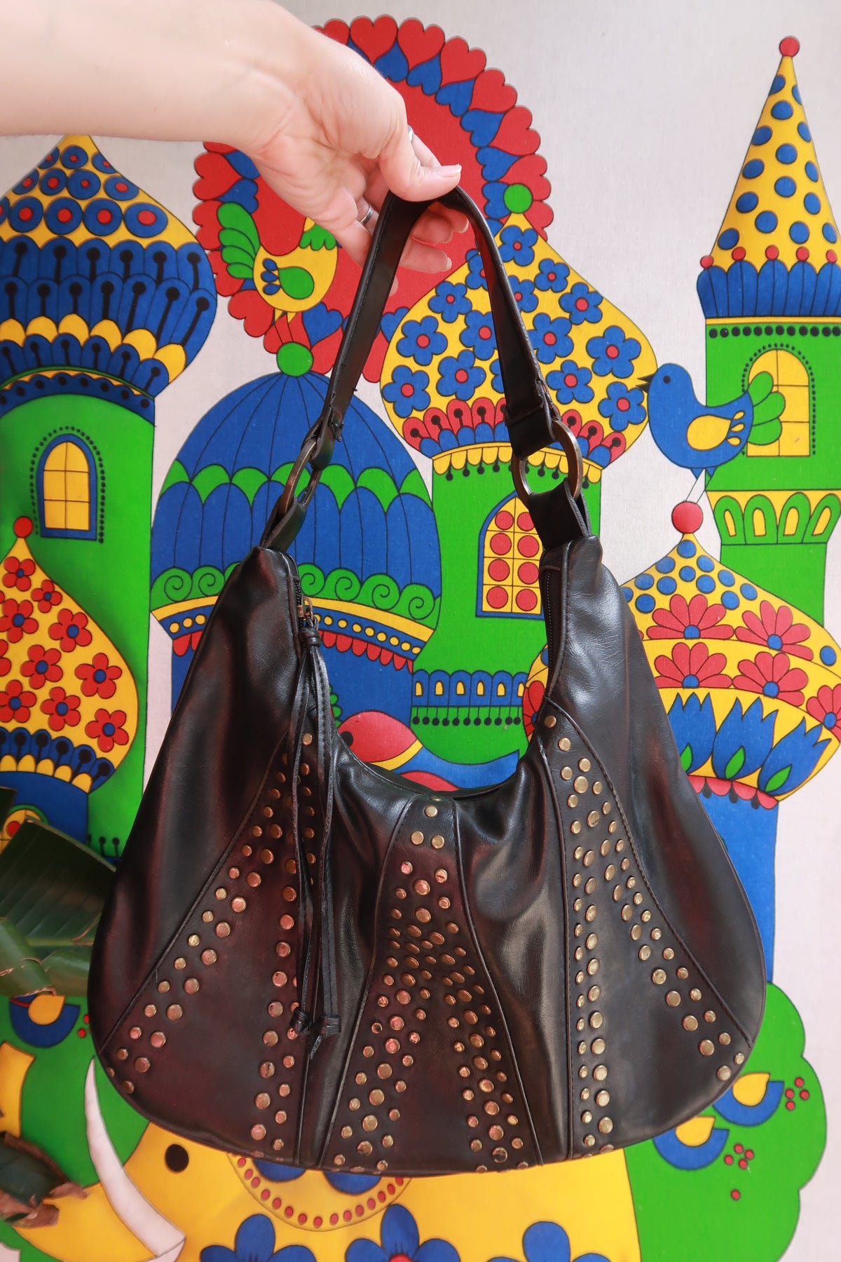 Elektra Vintage faux leather hobo shoulder bag with studded detailing and slouchy design, featuring a casual vintage style.