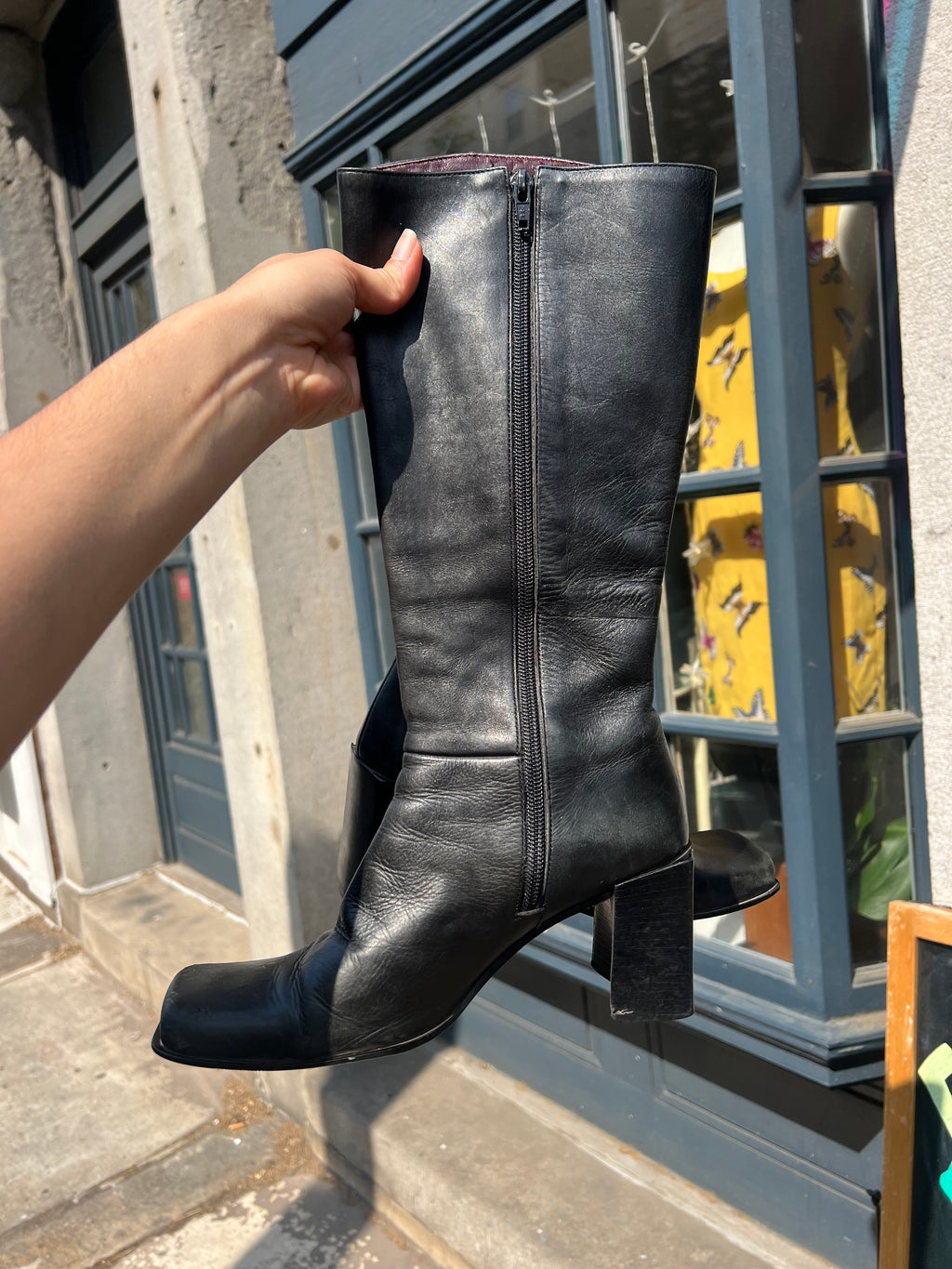 Vintage black leather mid-calf boots by Elektra Vintage, size 6, with a classic design and textured leather finish.