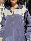 Vintage Adidas windbreaker jacket by Elektra Vintage, featuring classic design, lightweight fabric, and Adidas logo on the front.