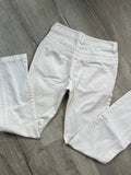 2000s vintage white denim low rise jeans for women by Elektra Vintage, showcasing a classic, casual style.