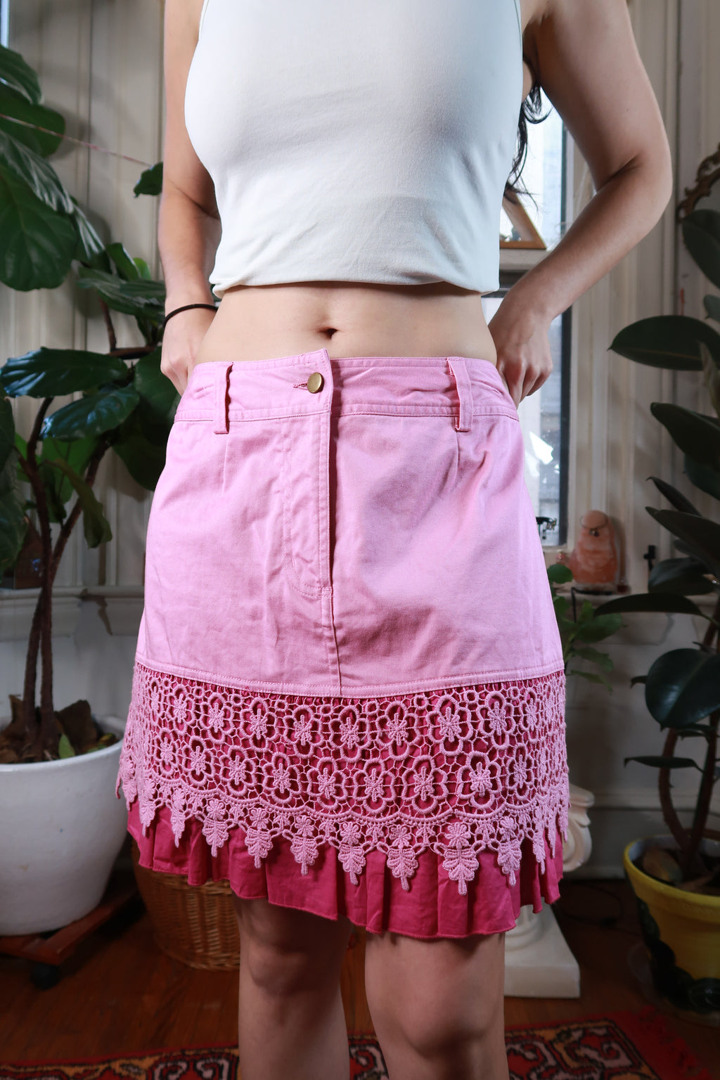 Vintage pink crochet lace ruffle hem skirt by Elektra Vintage, featuring detailed lace and flowing fabric.