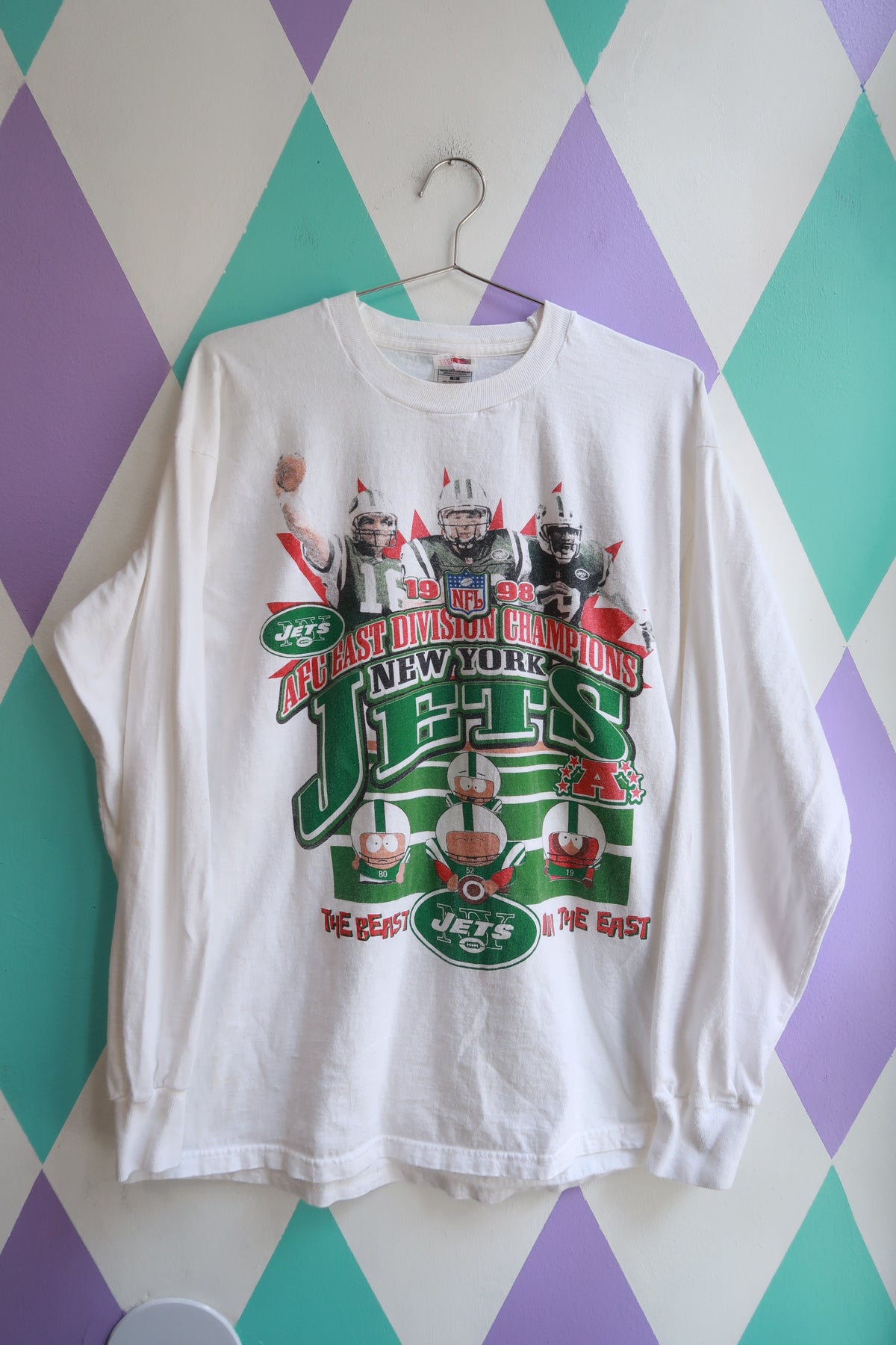 Men's vintage 1998 New York Jets South Park graphic AFC East Champions long sleeve tee by Elektra Vintage, featuring colorful team and cartoon design.