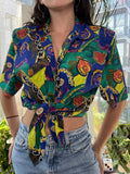 Women's vintage 80s abstract pattern button-up top by Notations, featuring bold geometric print and classic collar.