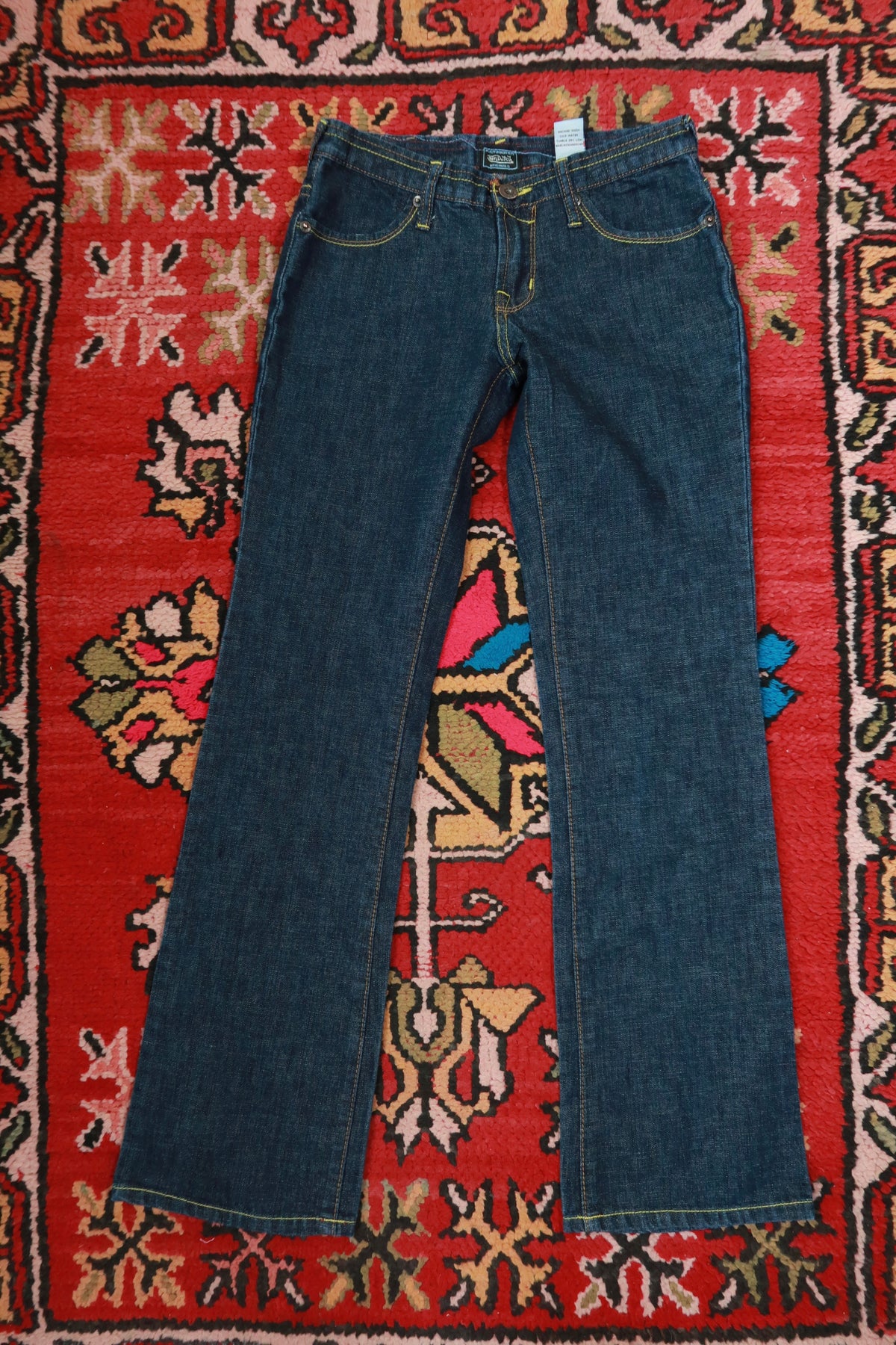 Elektra Vintage women's dark wash low rise bootcut jeans from the 2000s Von Dutch Y2K collection, size 27, denim bottoms.