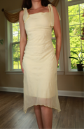 Vintage 2000s butter yellow tie strap midi dress by Elektra Vintage, featuring a fitted bodice and flowing skirt.