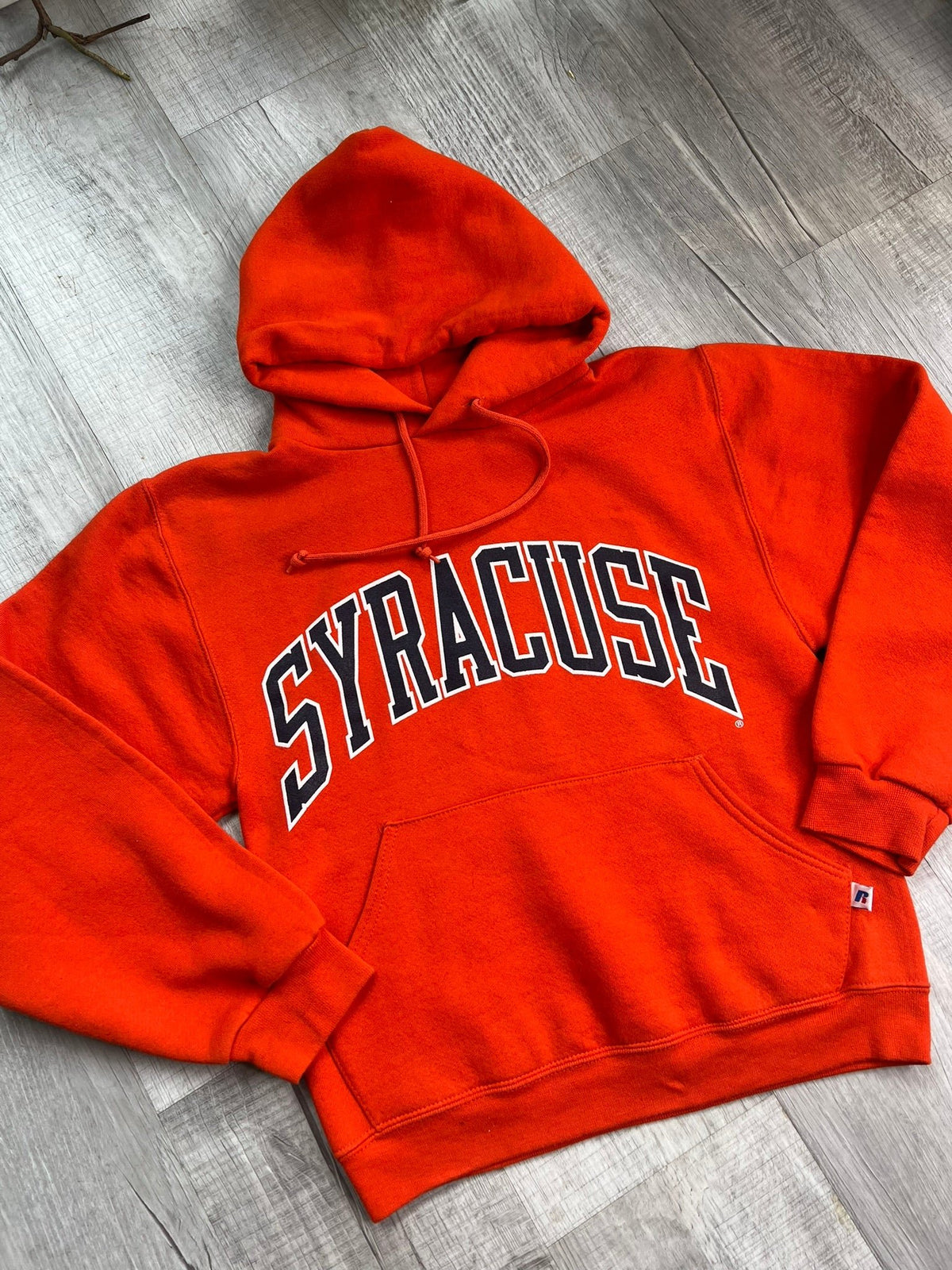 Vintage orange Syracuse University hoodie by Elektra Vintage, featuring university logo and classic hoodie design in a retro style.