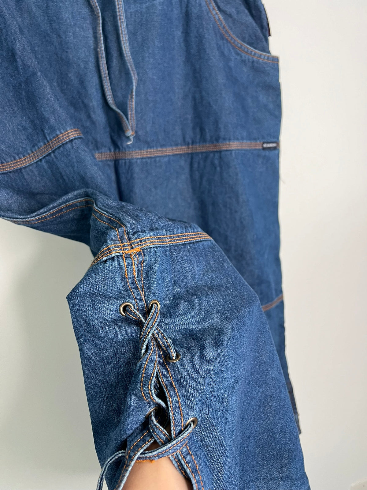 Elektra Vintage denim midi skirt with a high-waist design, featuring classic blue wash and side pockets.