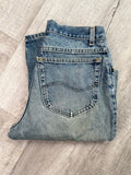 Men's Lee light wash high-waisted mom jeans from Elektra Vintage, featuring a relaxed fit and classic five-pocket design.