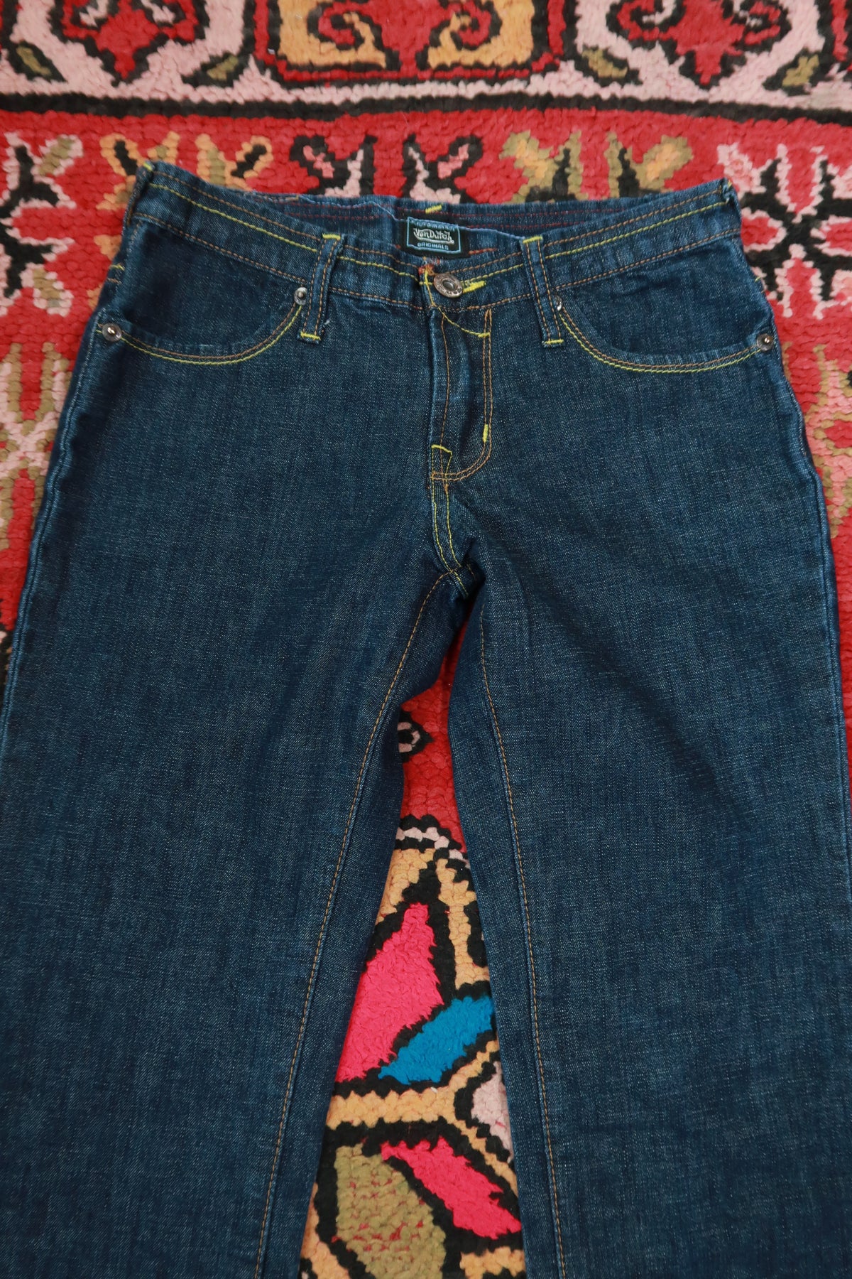 Vintage 2000s Von Dutch dark wash low rise bootcut jeans for women, size 27, from Elektra Vintage, styled with classic denim details.