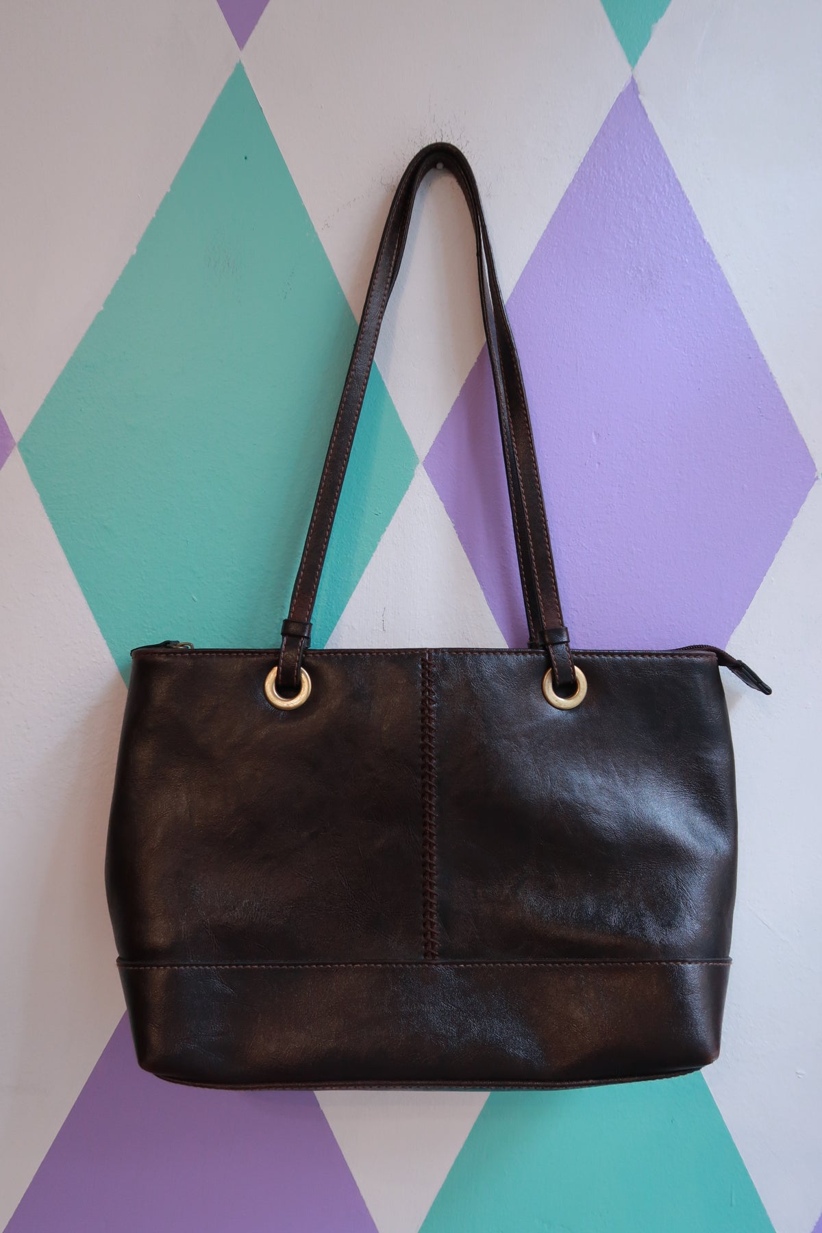 Vintage espresso brown Elektra Vintage shoulder bag with minimalist tote design, featuring a sleek leather purse style.