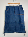 Vintage denim midi skirt by Elektra Vintage, featuring a classic blue wash and high waist, displayed on a hanger.