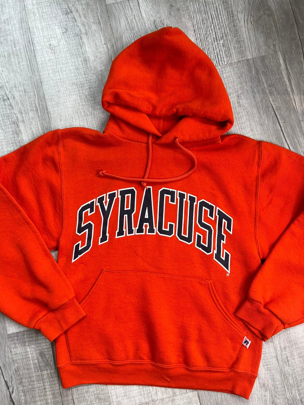 Vintage orange Syracuse University hoodie by Elektra Vintage featuring the university logo on soft cotton fabric.