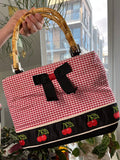 Vintage 2000s Elektra Vintage gingham cherry bag with bamboo handles, featuring a classic retro design and stylish craftsmanship.