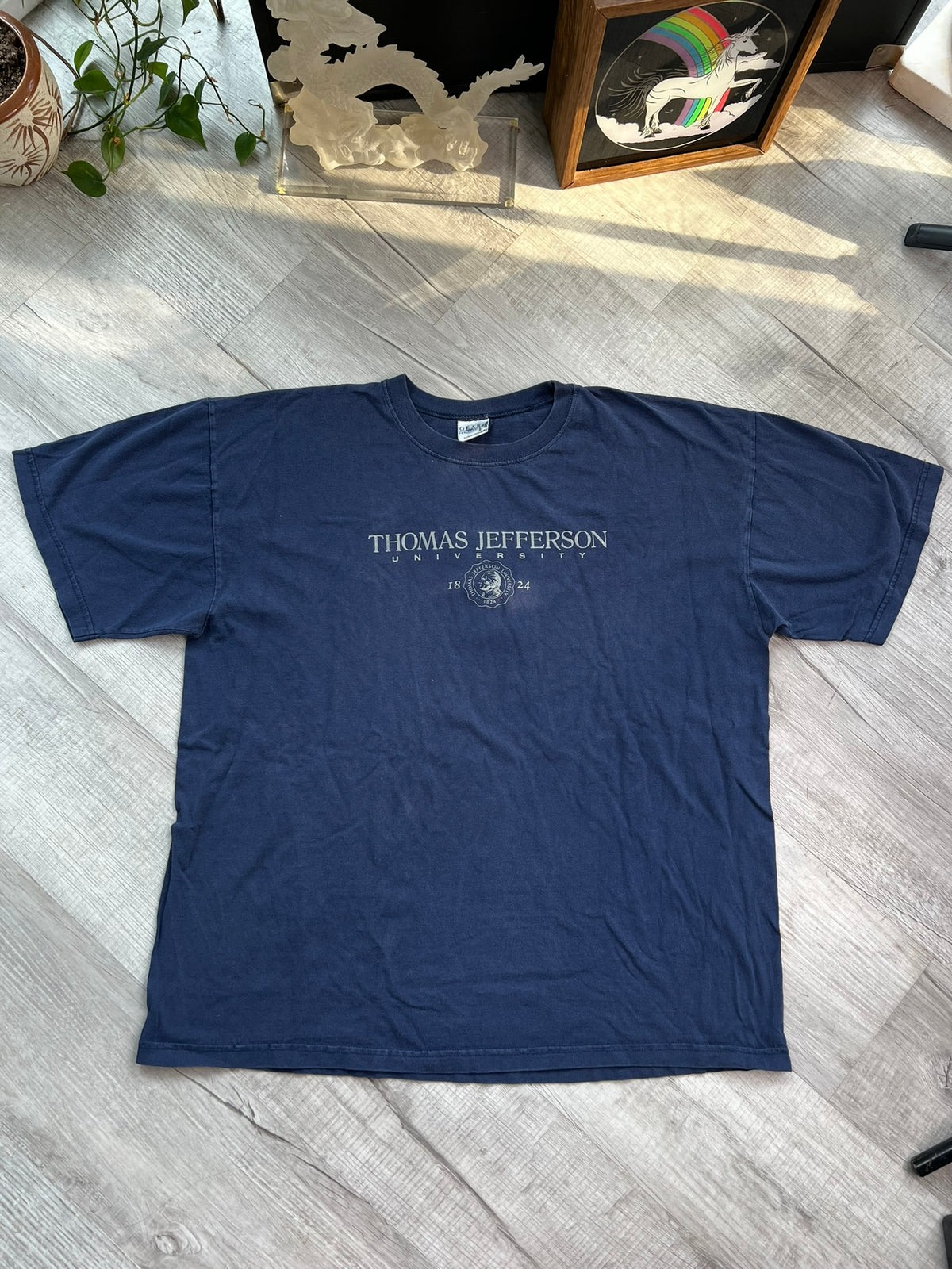 Vintage Thomas Jefferson University graphic T-shirt by Elektra Vintage, featuring a classic university logo on soft fabric.