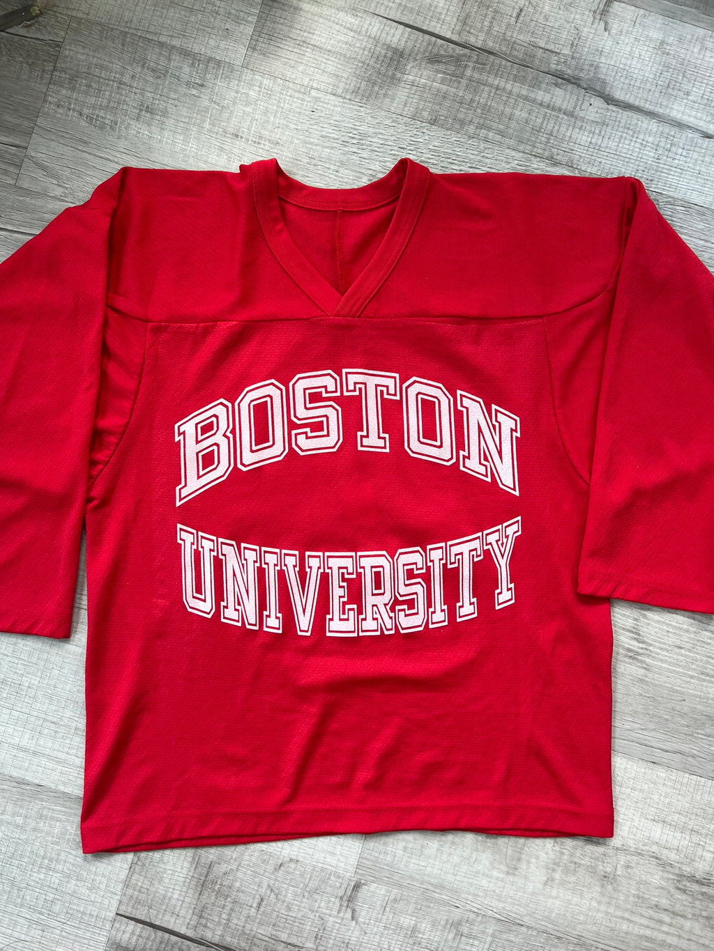 Vintage Boston University hockey jersey by Elektra Vintage, featuring classic university team logo and sports apparel design.