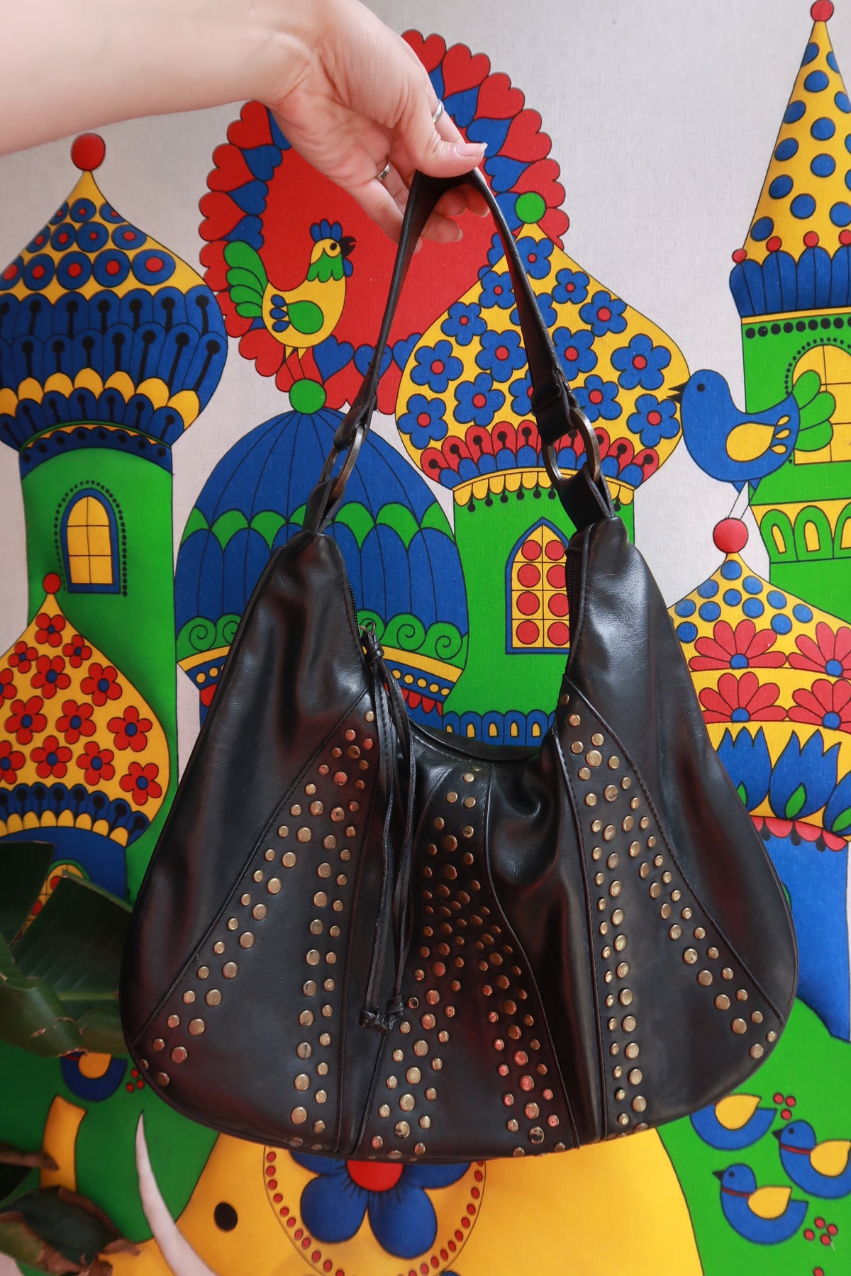 Elektra Vintage faux leather studded hobo shoulder bag with adjustable strap and rustic design, featuring metal stud embellishments.