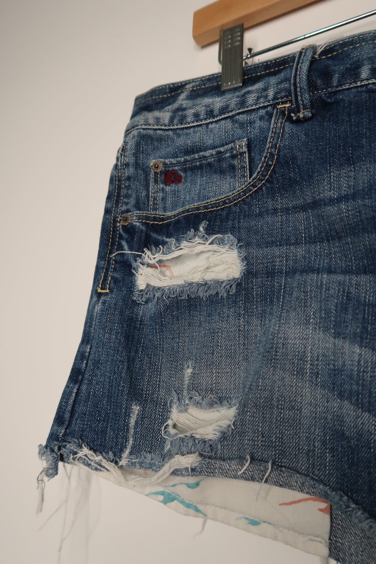 Vintage 2000s Hollister denim skirt by Elektra Vintage, showing classic high-waisted design with distressed details.