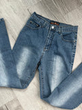 Vintage light wash denim low rise jeans for women by Elektra Vintage, showing the relaxed fit and classic 2000s style.