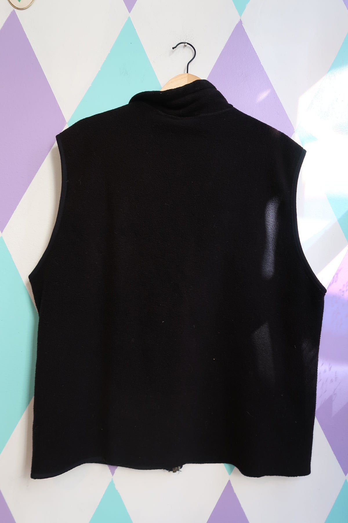 Men's vintage Patagonia black fleece vest by Elektra Vintage, showcasing the soft fleece fabric and classic fit.