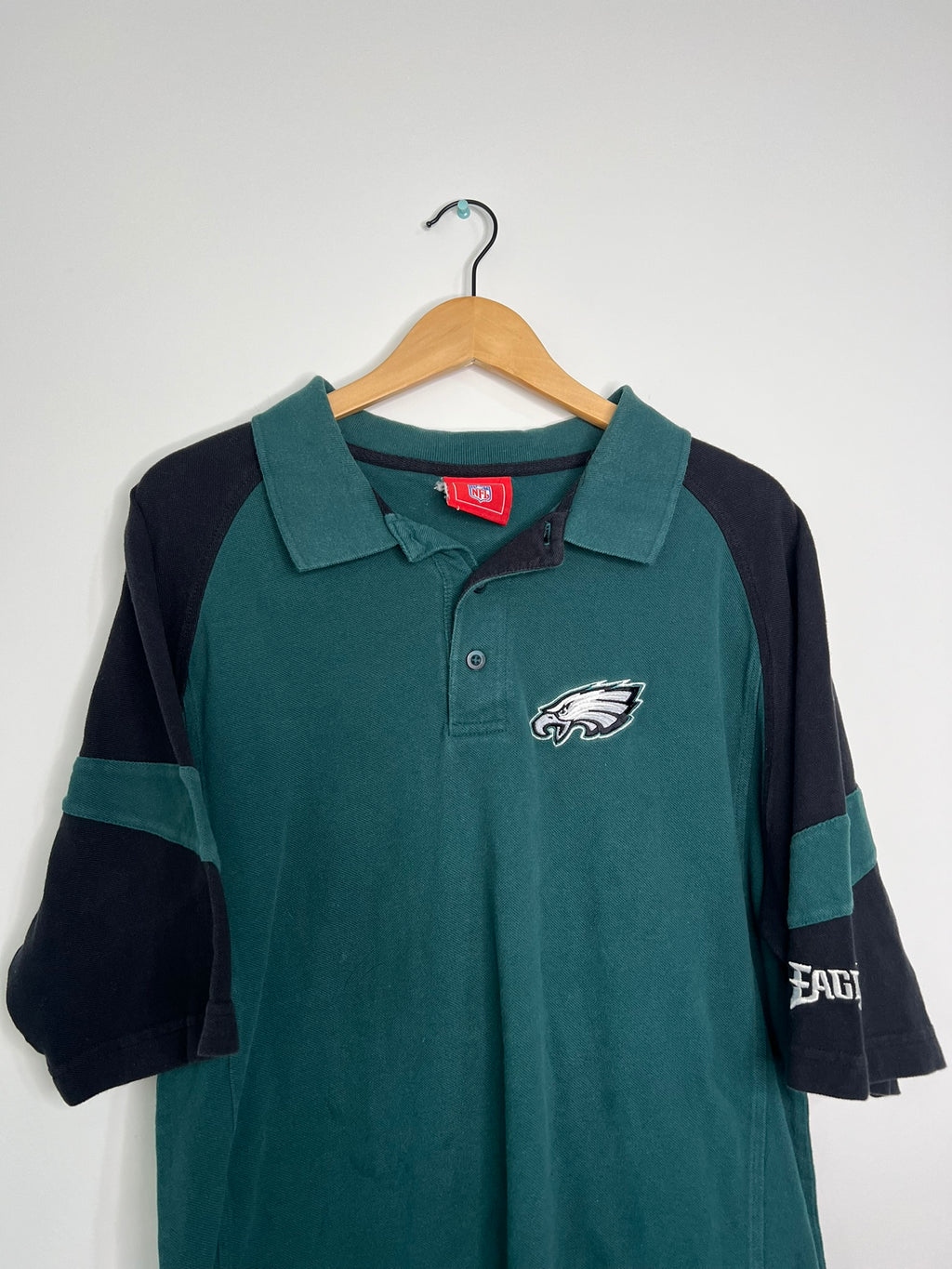 Vintage 2000s Eagles polo shirt by Elektra Vintage, featuring classic design and embroidered eagle logo on soft fabric.