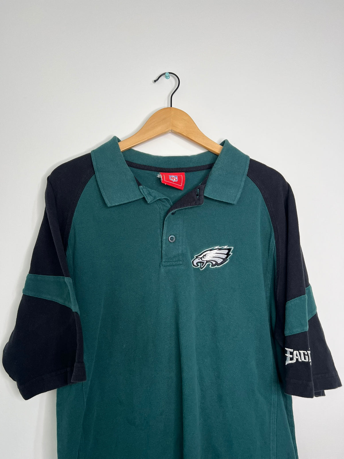 Vintage 2000s Eagles polo shirt by Elektra Vintage, featuring classic design and embroidered eagle logo on soft fabric.