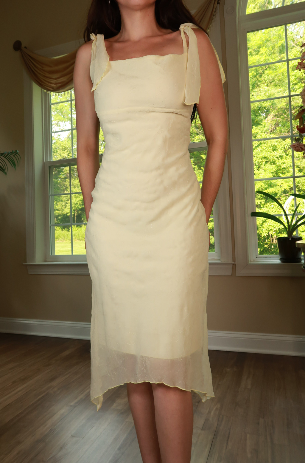 Vintage 2000s butter yellow tie strap midi dress by Elektra Vintage, featuring a fitted bodice and flowing skirt.