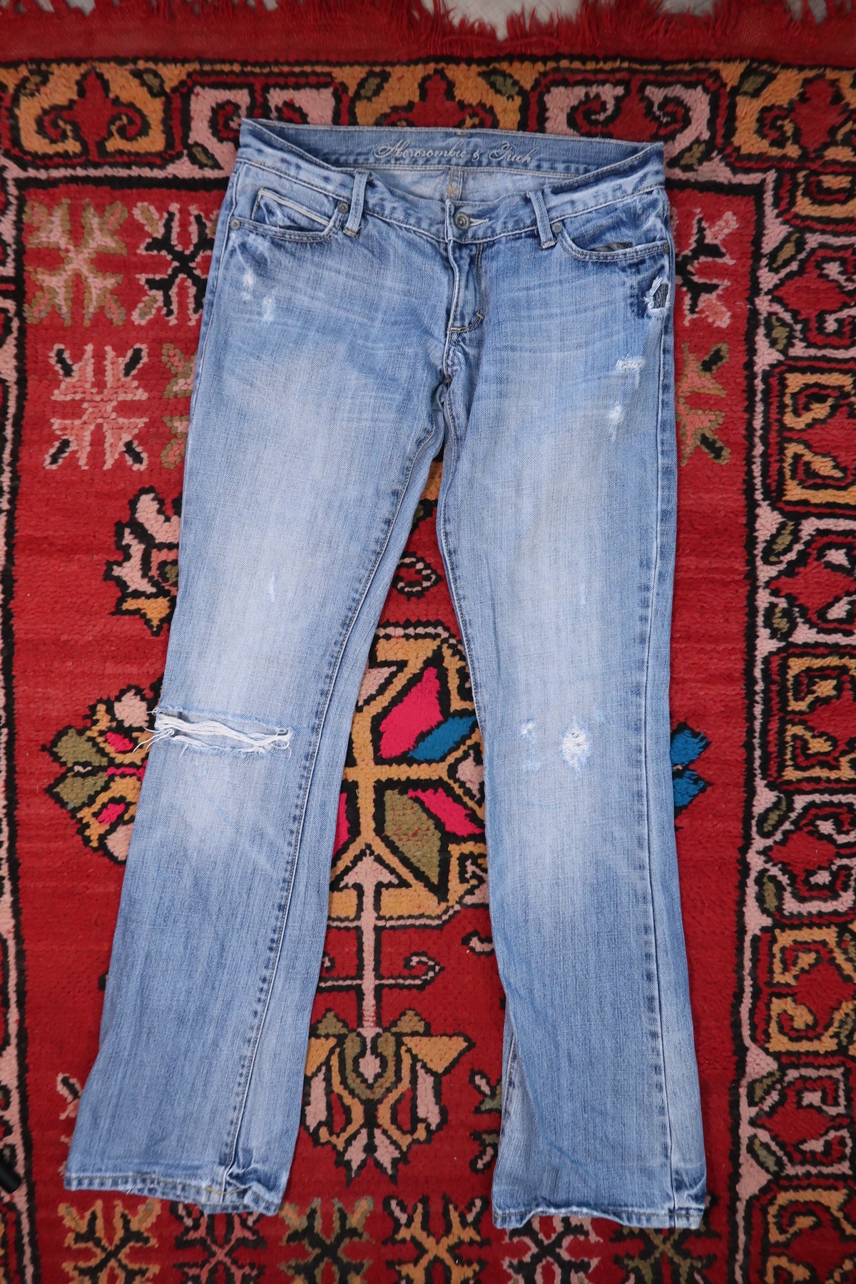 Elektra Vintage Y2K Abercrombie & Fitch distressed low-rise women's jeans with a vintage, distressed denim look.