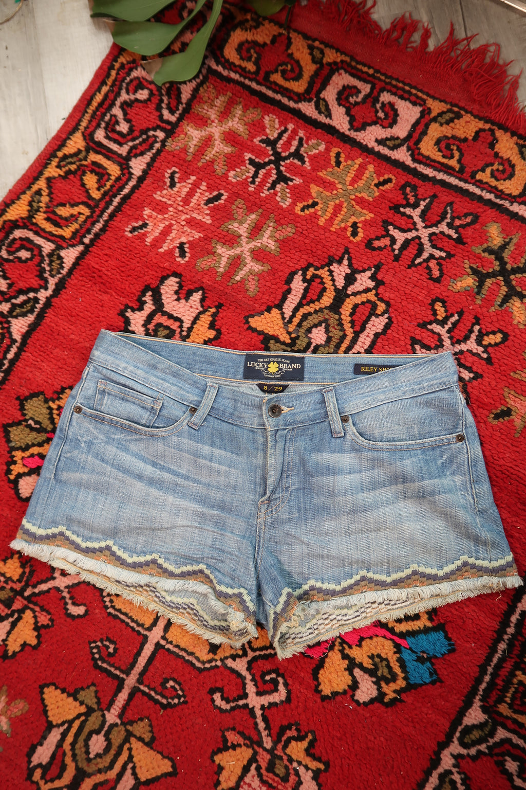 Vintage Lucky Brand low rise denim shorts with embroidered hem, women's casual bottoms, Elektra Vintage style.