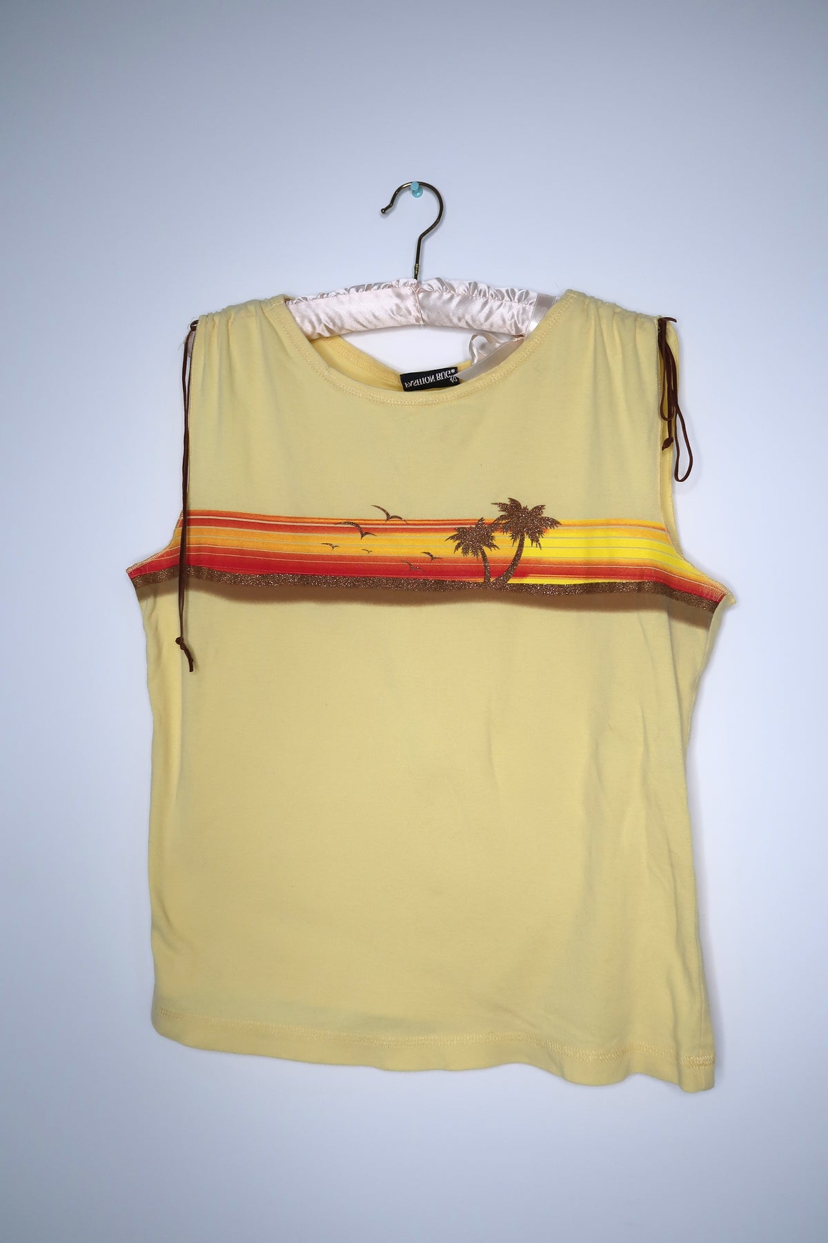 Elektra Vintage women's 2000s vintage palm tree tank top with tropical print on soft fabric, casual summer fashion piece.