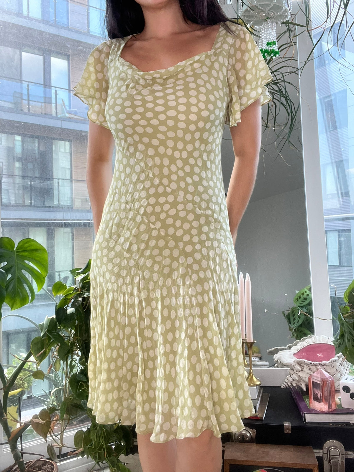 Vintage Elektra Vintage silk polka dot bias cut dress, showing its flowing fabric and classic pattern in a full-length view.