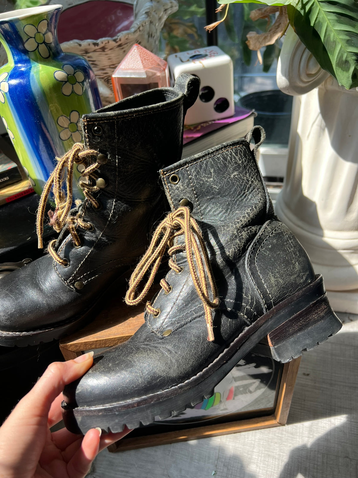 Vintage Elektra Vintage leather combat boots with rugged design and laces, featuring a worn-in, stylish appearance.