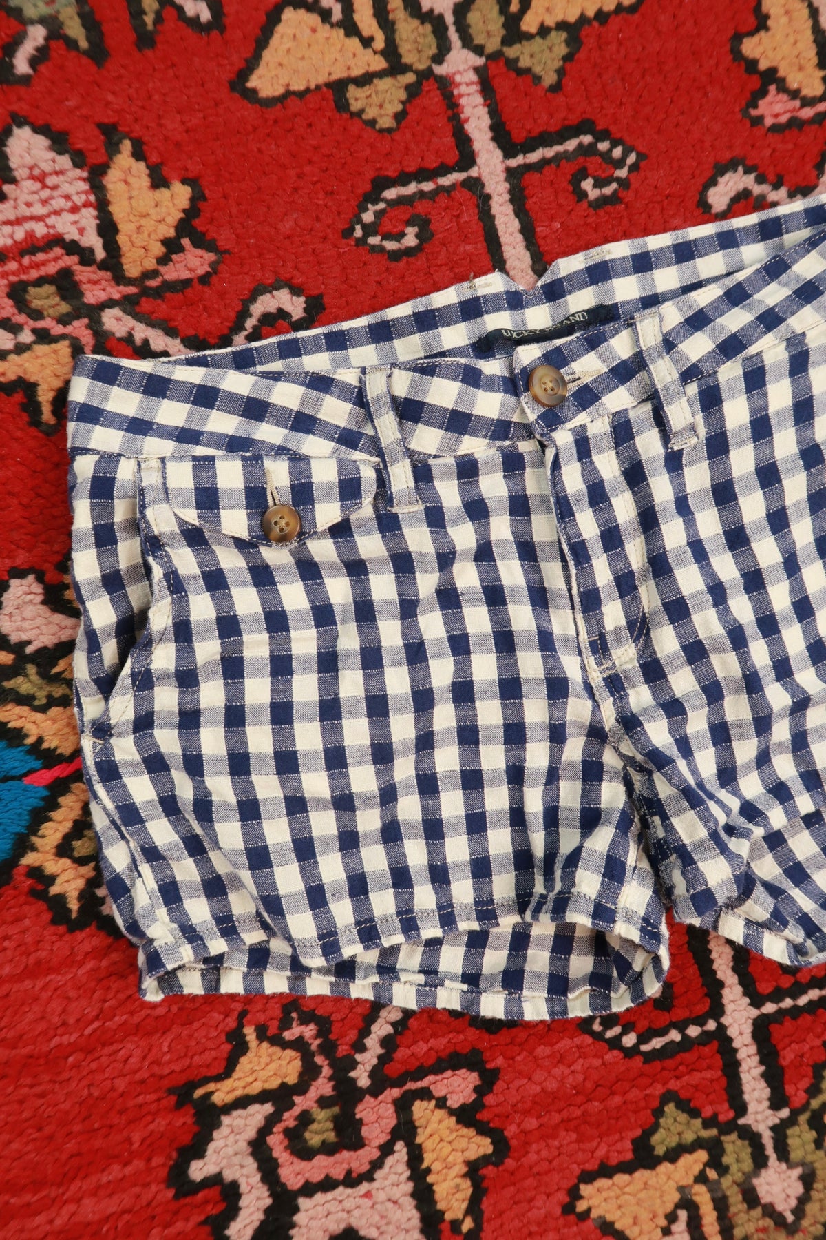 Women's navy blue gingham linen blend shorts by Lucky Brand, vintage 2000s style, displayed on a hanger.