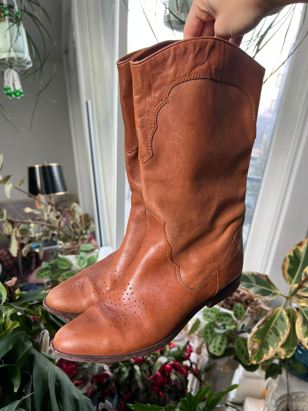 Vintage tan western cowboy boots by Elektra Vintage featuring classic leather design and pointed toes.
