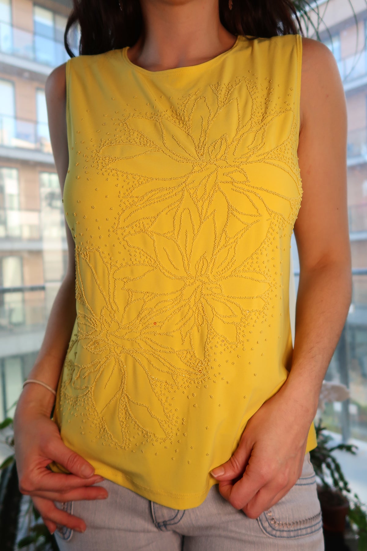 Vintage yellow beaded sleeveless top with 90s floral beadwork from Elektra Vintage, showcasing intricate floral patterns and beaded details.