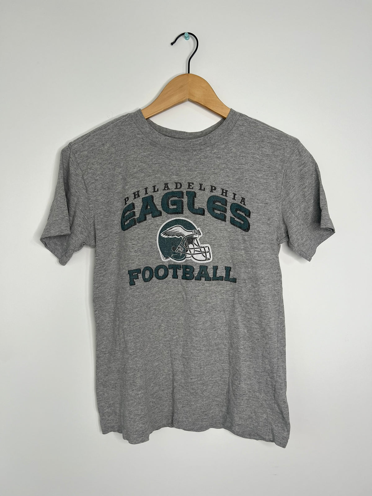 Elektra Vintage Eagles football graphic baby doll tee, soft cotton shirt with team logo and playful football design.