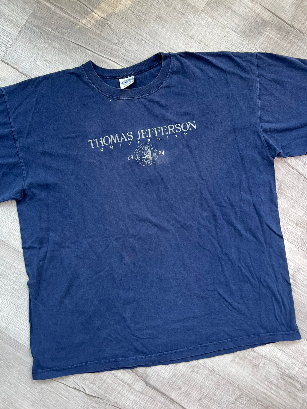 Vintage Thomas Jefferson University graphic tee by Elektra Vintage, featuring a classic university logo on soft cotton fabric.