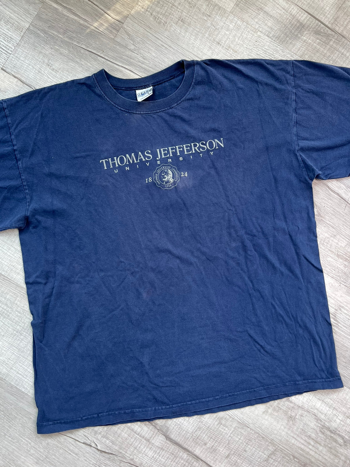 Vintage Thomas Jefferson University graphic tee by Elektra Vintage, featuring a classic university logo on soft cotton fabric.