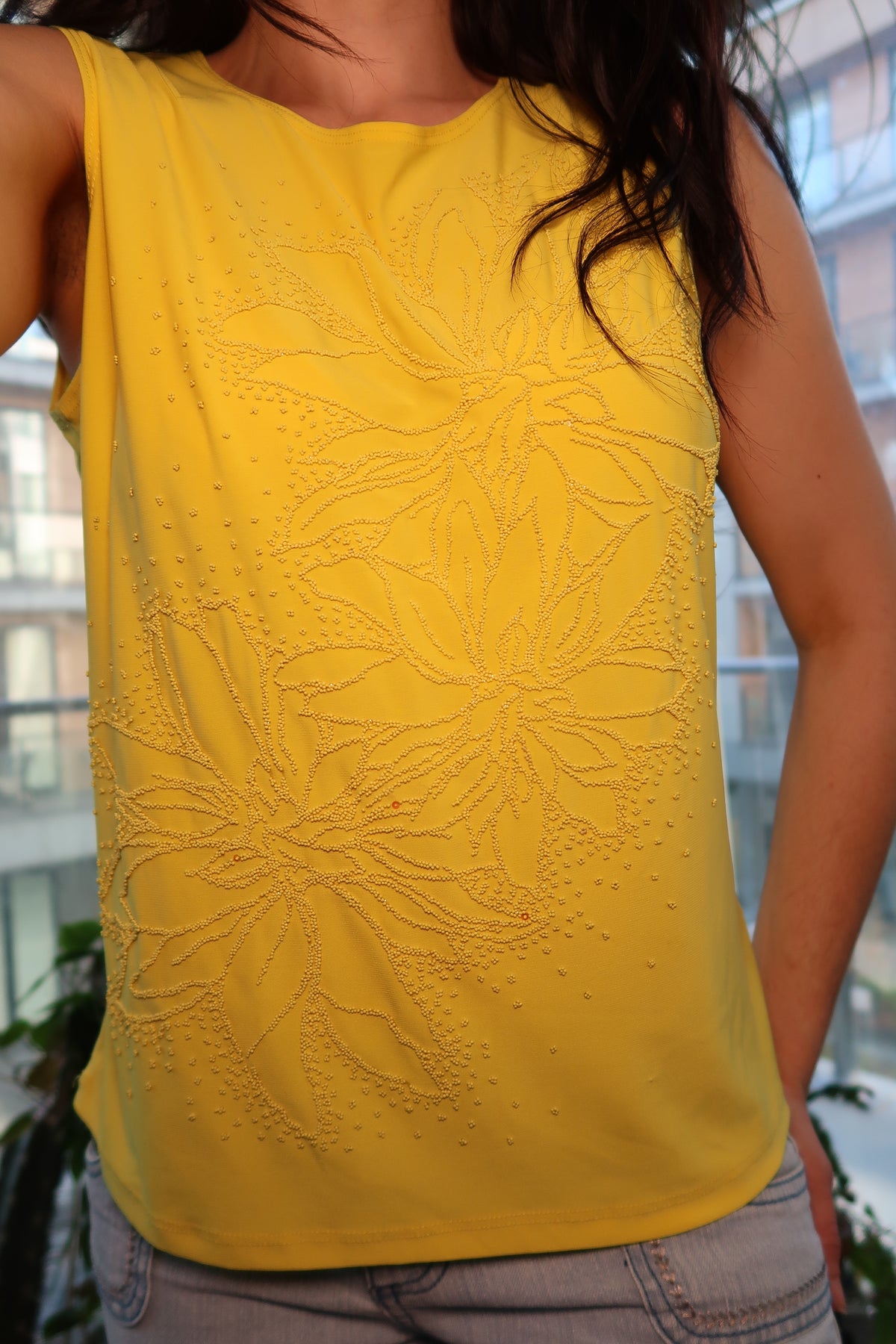Vintage yellow beaded sleeveless top with 90s floral beadwork, women's tank by Elektra Vintage, shown on a hanger.