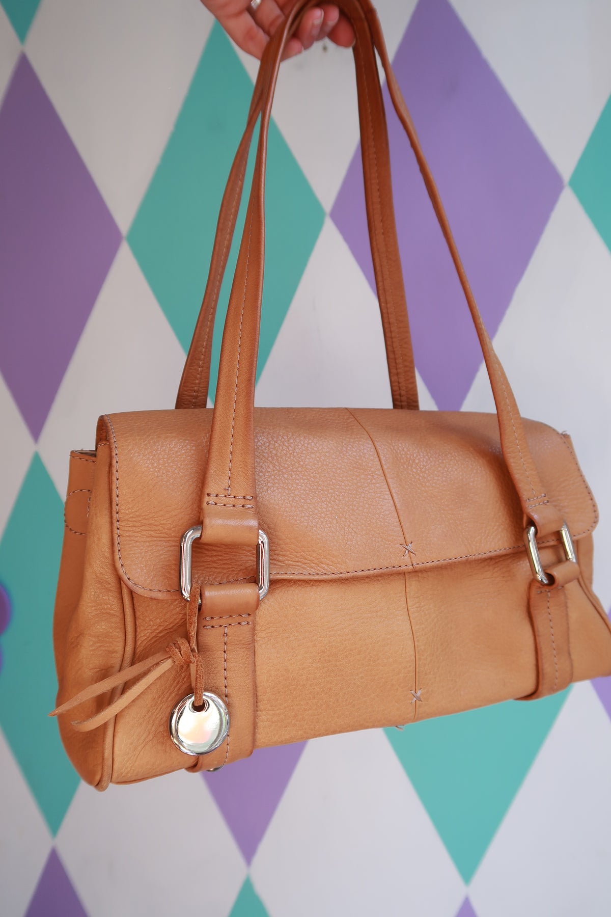 Vintage tan leather shoulder bag by Elektra Vintage featuring minimalist design and a classic satchel style.