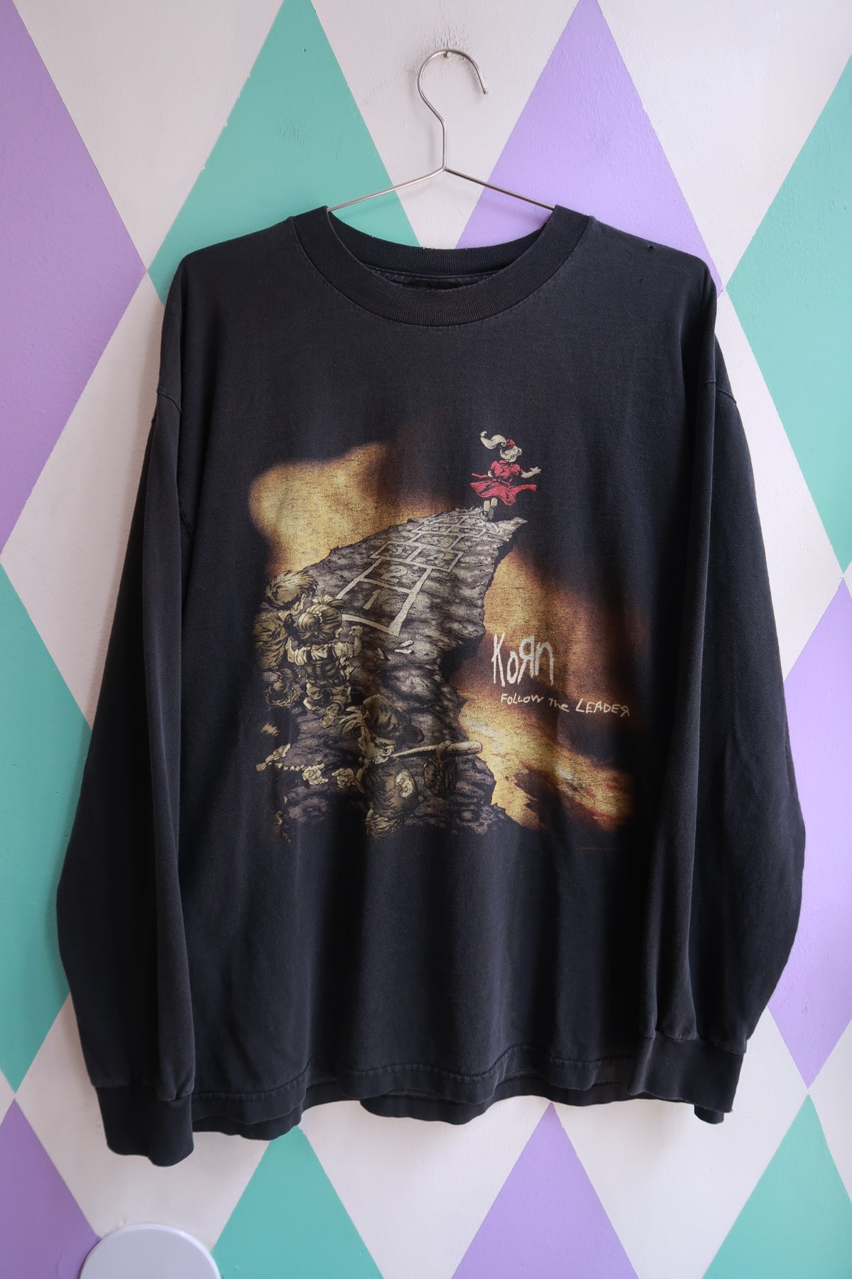 Black vintage 1998 Korn "Follow the Leader" graphic long sleeve t-shirt for men by Elektra Vintage, featuring band artwork on the front