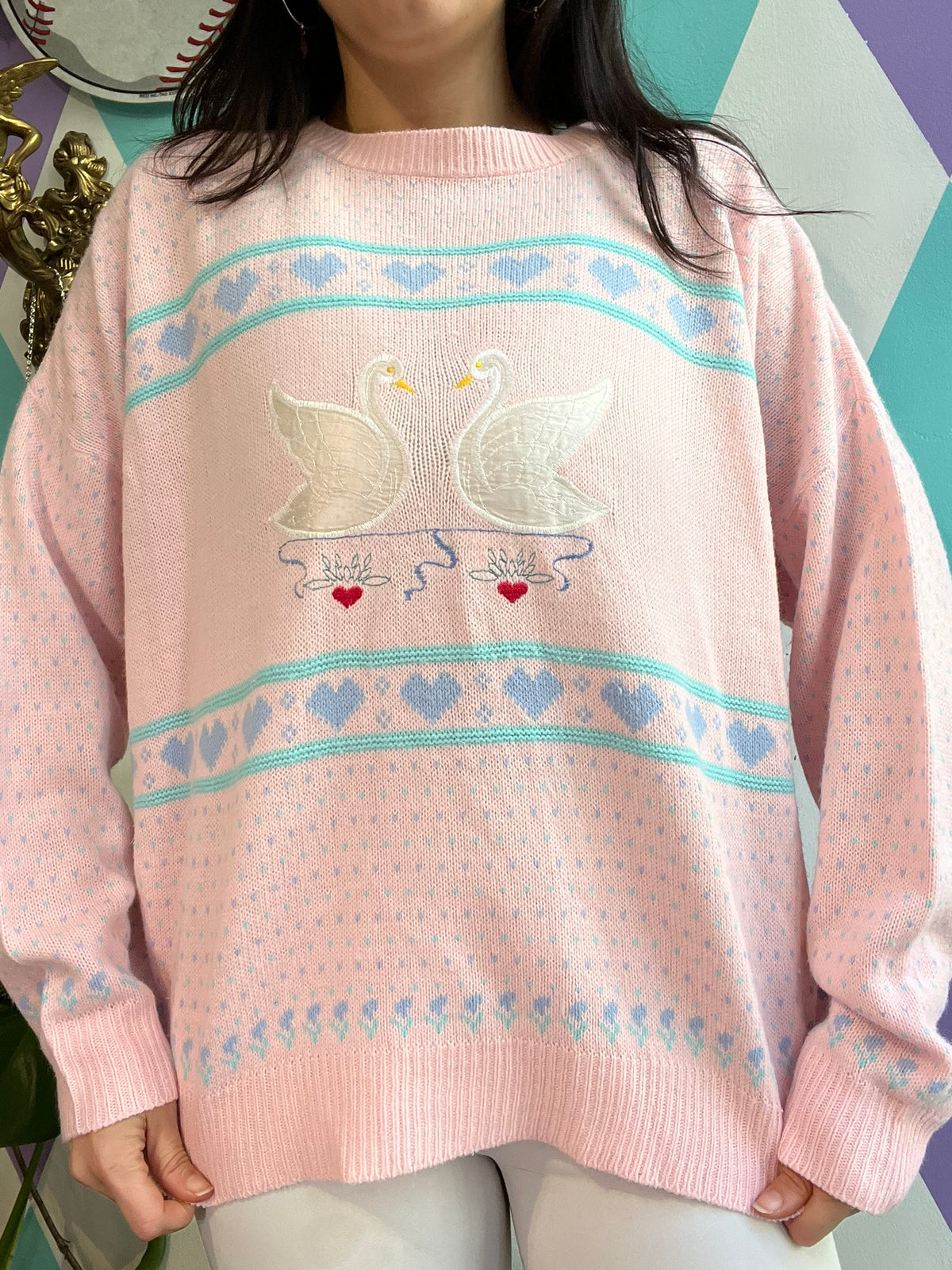 Elektra Vintage pink knit sweater featuring a vintage swan design, cozy and stylish women's sweater with intricate knit pattern.
