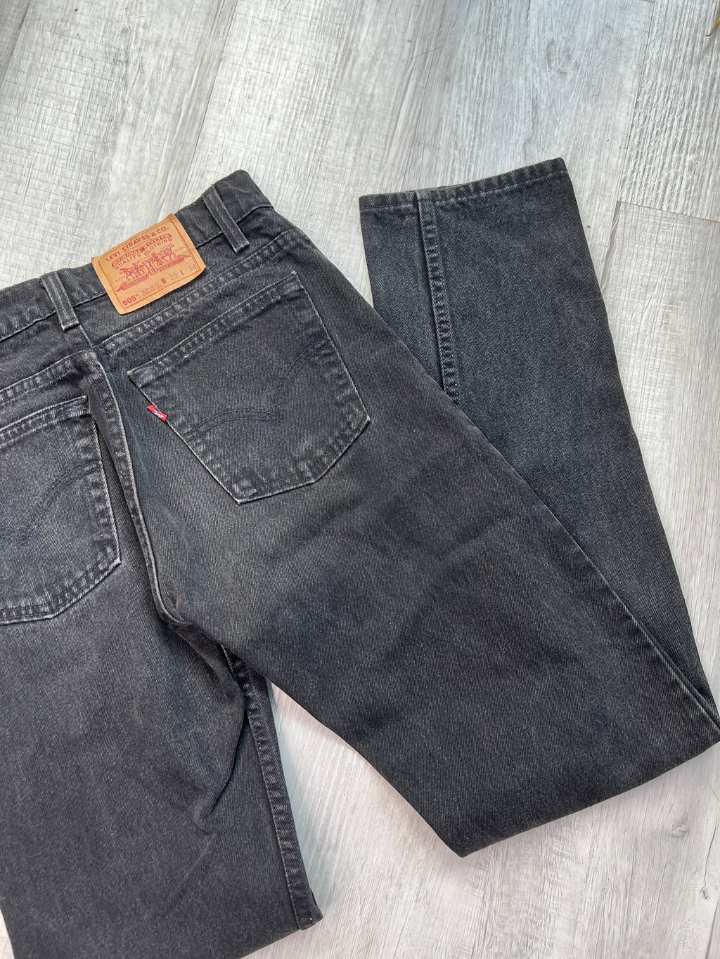 Vintage black Levi’s 505 jeans by Elektra Vintage, showing classic straight-leg fit and denim texture.