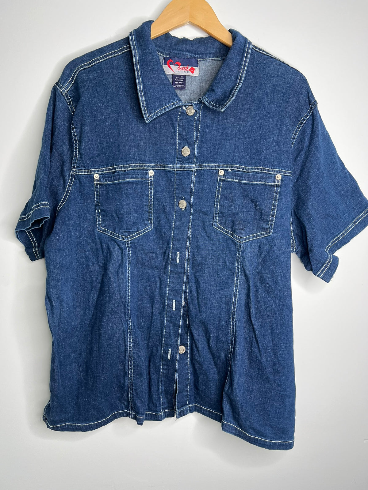 Women's 2000s vintage denim button-up shirt by Elektra Vintage, featuring classic denim fabric and a stylish button front design.