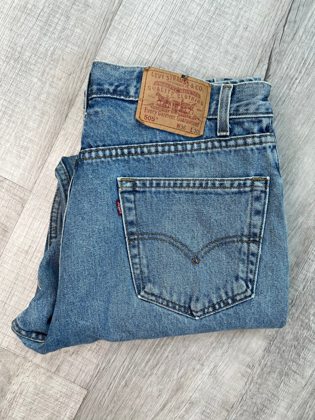 Men's Levi’s 505 regular fit straight leg jeans with medium wash and paint splatter details, from Elektra Vintage.