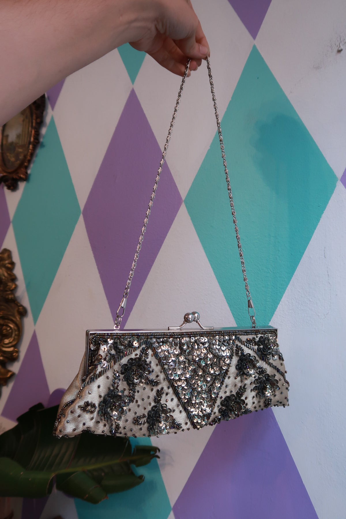 Vintage silver beaded evening clutch bag with sequin floral design and chain strap, by Elektra Vintage.